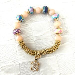 Bracelet rhinestone turtle multi color beads. Fits wrist up to 8 inches. NWT
